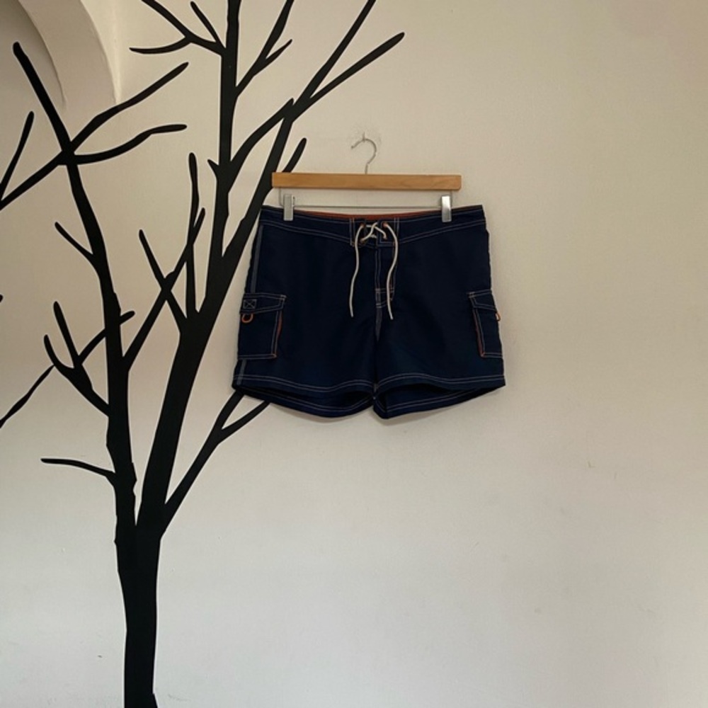 Good Vibes navy + orange swim trunks